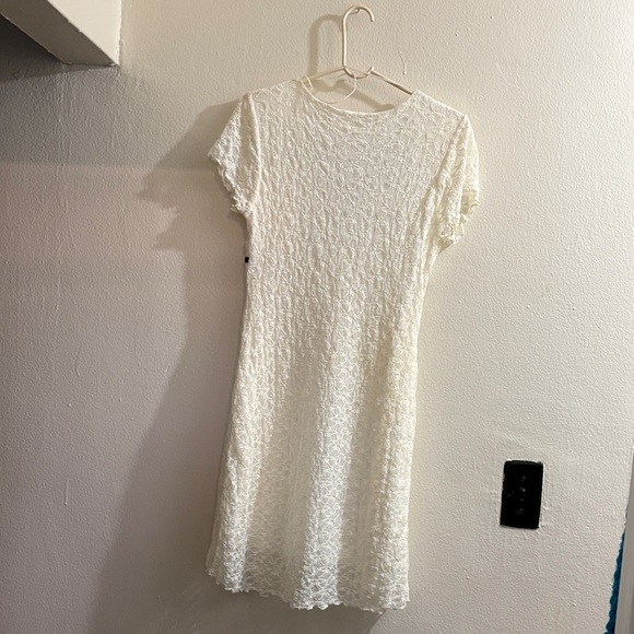 Elegant White Lace Mini Dress with Black Trim - Picture 2 of 2